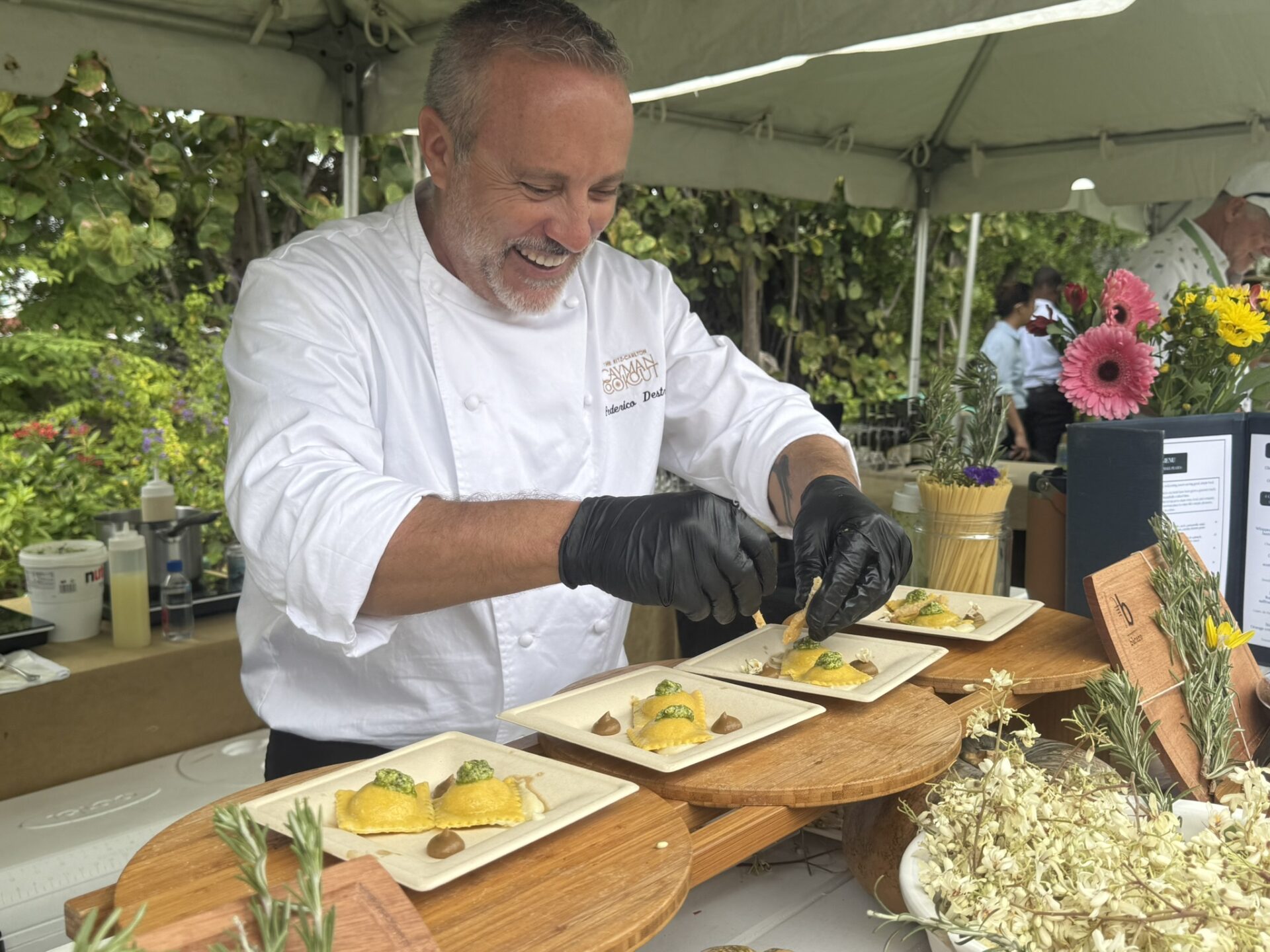 Chef Federico Destro of Barcaro preparing roasted pumpkin ravilio at Grown in Cayman