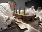 Cayman Cookout kicks off with Michelin chefs making Meals on Wheels Michelin-starred chefs including José Andrés (left) helped prepare meals for Meals on Wheels at the start of Cayman Cookout