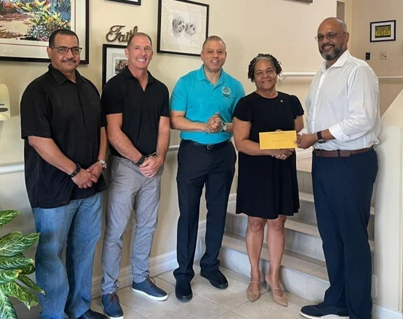 From Left to Right: Minister Rolston Anglin for Finance & Economic Development and Education & Training, Scott Somerville – Pines Board Chairman, Premier André Ebanks, Lynda Mitchell – Chief Executive Officer Pines, and Minister Isaac Rankine for Social Development & Innovation