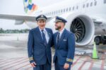 Cayman Airways captain completes final flight with son as co-pilot