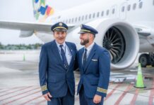 Cayman Airways captain completes final flight with son as co-pilot