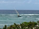 Couple rescued after sailboat runs aground