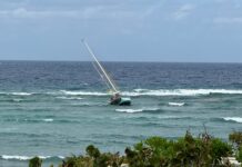 Couple rescued after sailboat runs aground