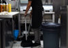 MP warns about ‘unintended consequence’ of minimum wage Restaurant kitchen employee sweeping the floor