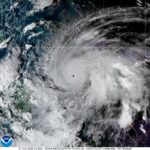 NOAA declares El Niño as forecasters downgrade hurricane outlook