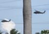 Three US Blackhawk helicopters refuel in Grand Cayman