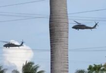 Three US Blackhawk helicopters refuel in Grand Cayman