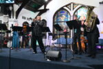 Rodney Marsalis and his brass band marches in and wows the CayMusicA crowds