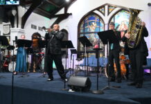 Rodney Marsalis and his brass band marches in and wows the CayMusicA crowds